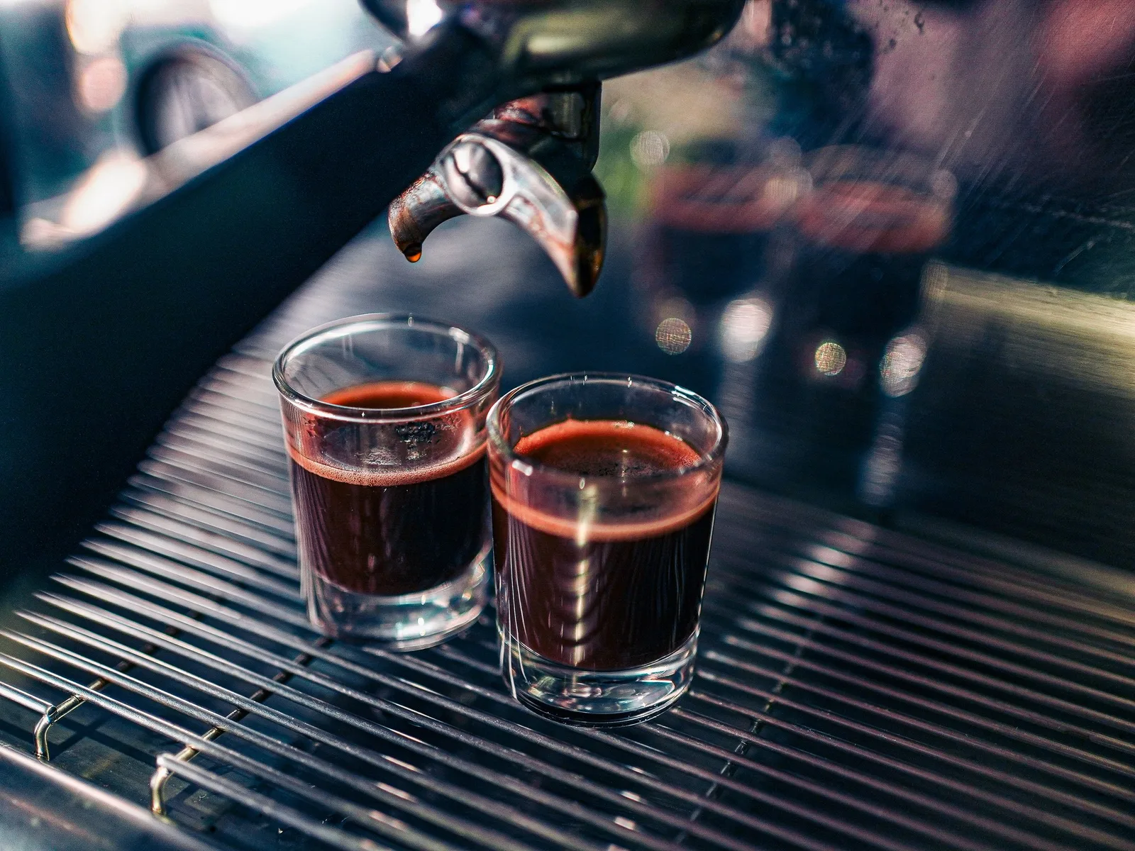 Two espresso shots under the machine