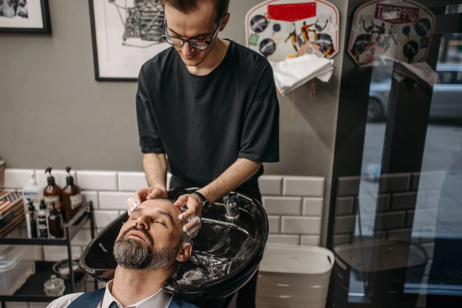 A client’s hair being washed at the basin