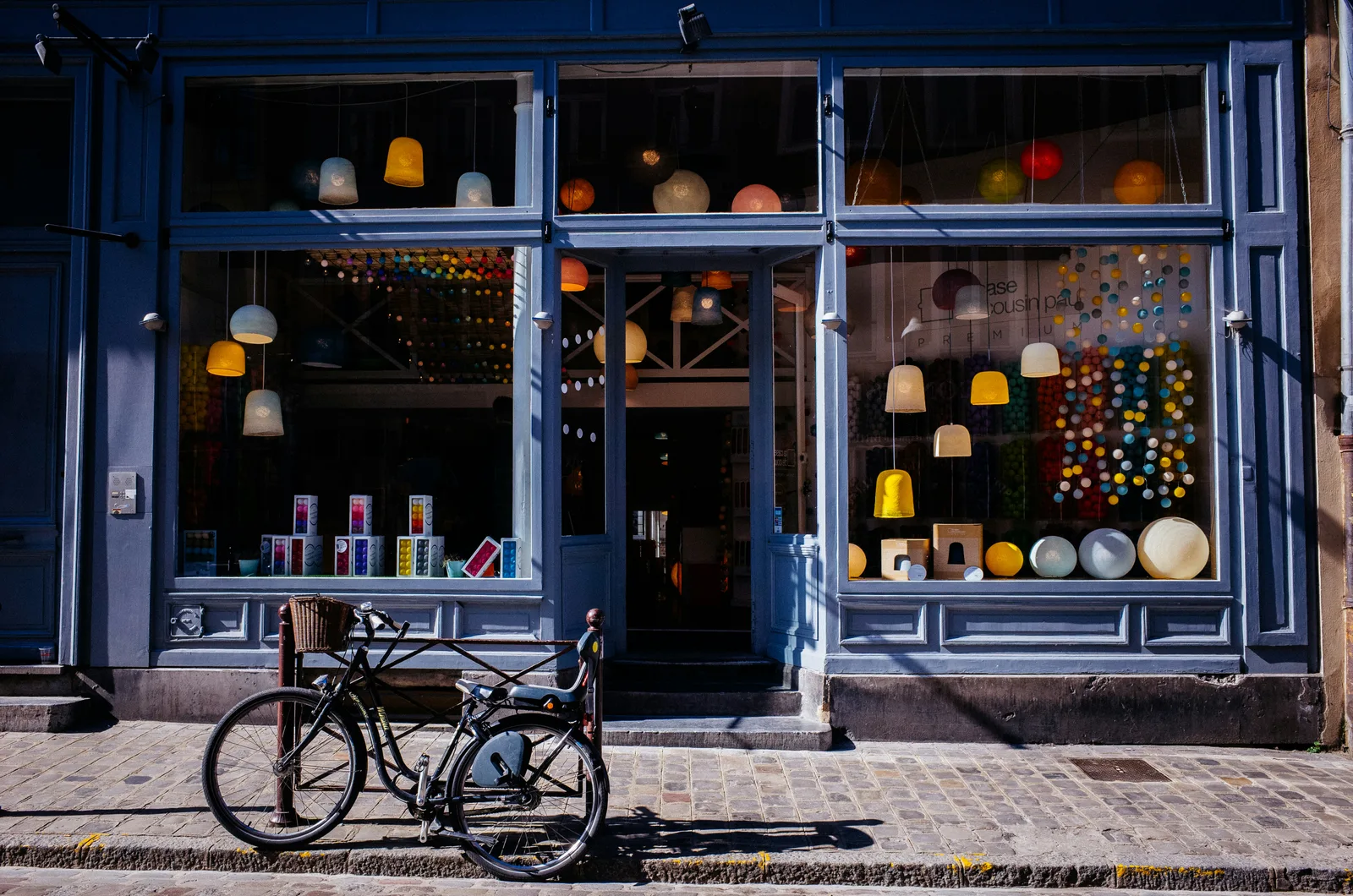 A small shop front with a bicycle outside